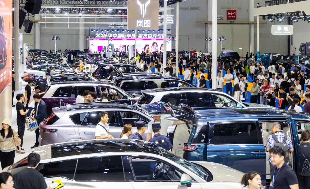 Vehicles and visitors at the Central China auto show in Wuhan